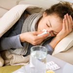 Sick Woman. Flu. Woman Caught Cold. Sneezing into Tissue